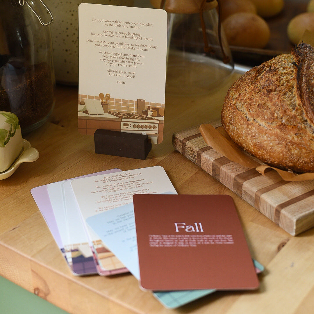 Kitchen counter with bread, cards, and a measuring cup